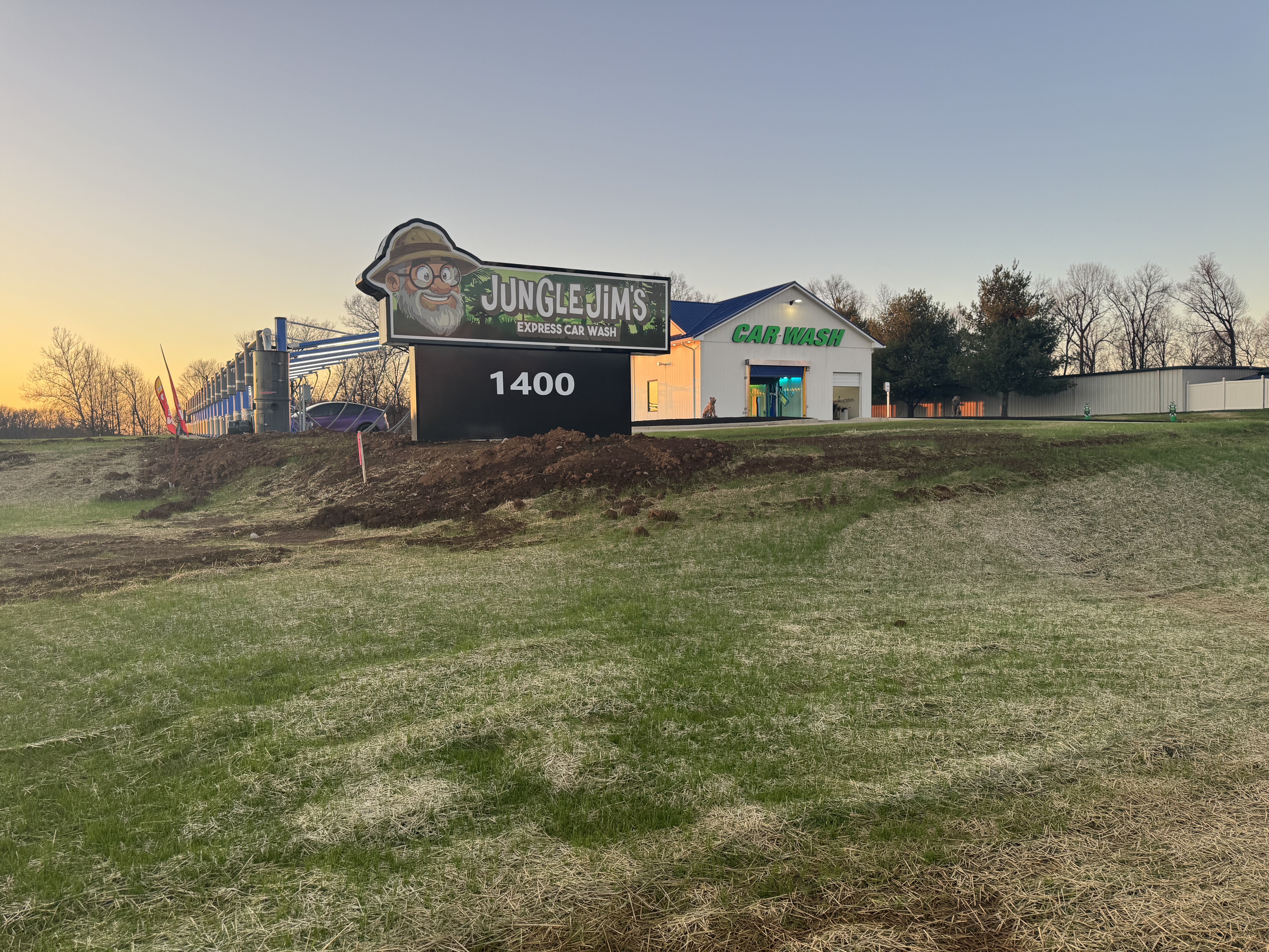 Jungle Jim's Express Car Wash pylon sign and building viewed from the road, 1400 Withrow Court, Bardstown, KY